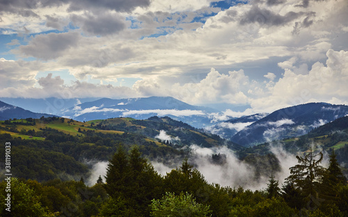 View from the Synevyr pass to the foggy mountains in National Natural Park Synevir, Mizhhirya district of the Transcarpathian region, Ukraine