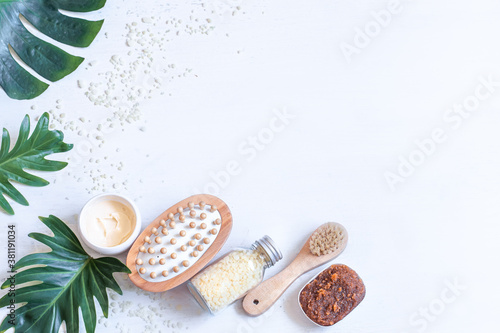 Spa composition with body care items and leaves.