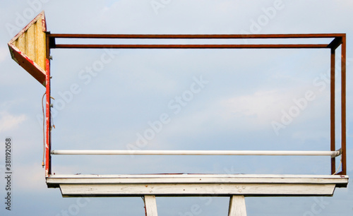 Εκτύπωση καμβά Large rusting old-fashioned billboard sign frame with blue sky.