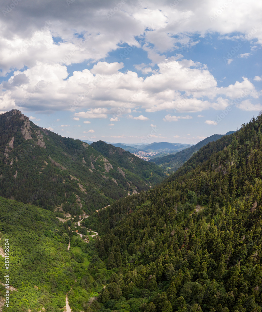 Aerial horizontal panorama of mountain with view to the city from drone. Smolyan, Bulgaria.