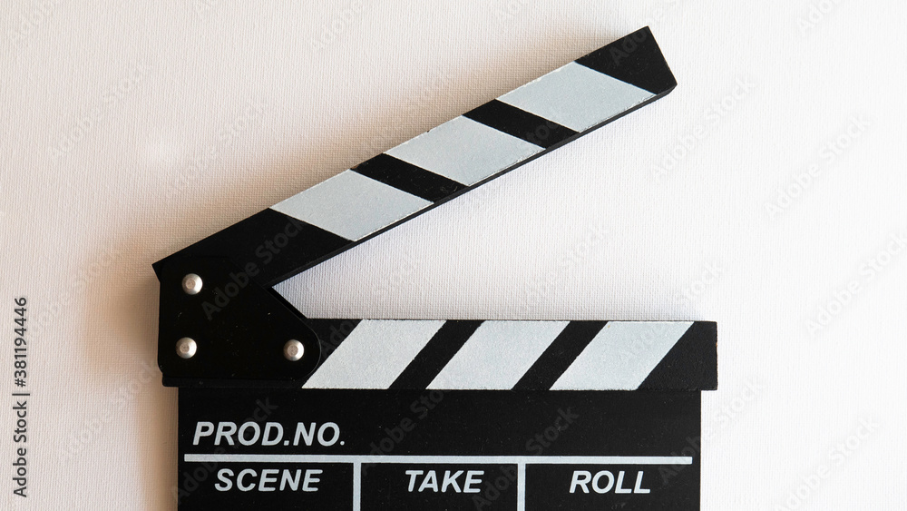 Obraz premium Close up of a wooden black clapperboard isolated on white background.