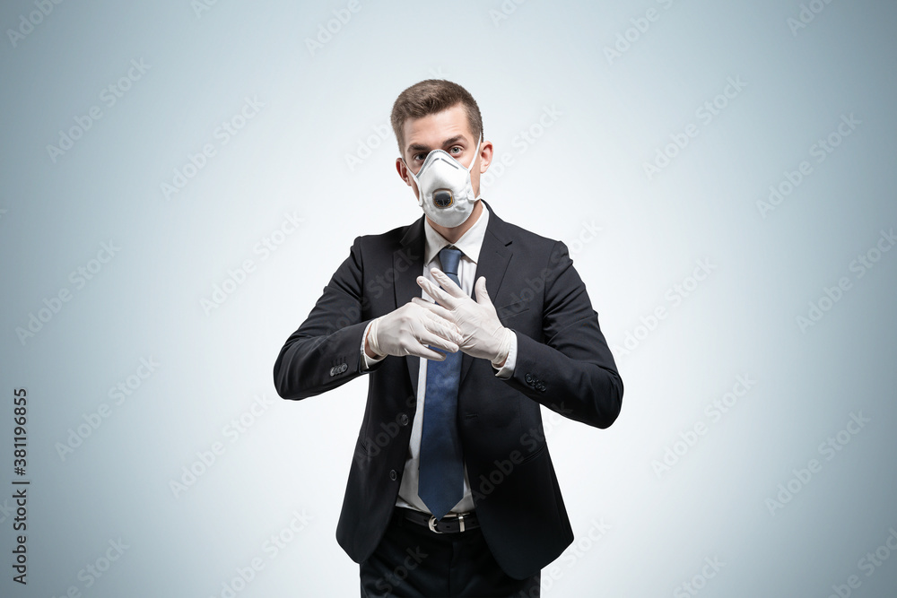 Businessman in protective mask and gloves Businessman in protective mask and gloves
