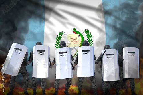 Wallpaper Mural Guatemala protest stopping concept, police squad in heavy smoke and fire protecting peaceful people against mutiny - military 3D Illustration on flag background Torontodigital.ca
