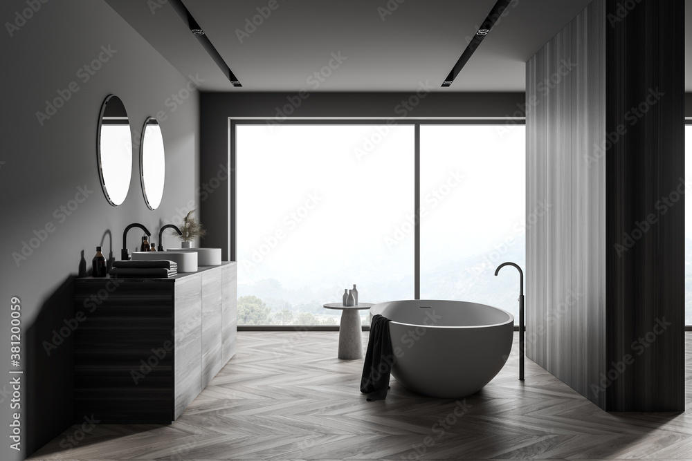 Stylish gray and wooden bathroom with double sink and tub Stylish gray and wooden bathroom with double sink and tub