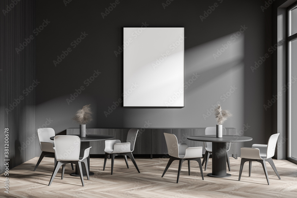 Stylish dark gray cafe interior with poster and sofa Stylish dark gray cafe interior with poster and sofa