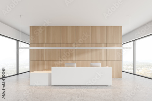 White reception desk in white and wooden office