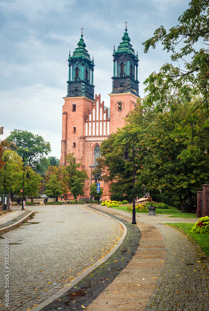 Road to the Church of Saints Peter and Paul on Tumsky Island in cloudy weather: Poznan / Poland - September 27, 2020