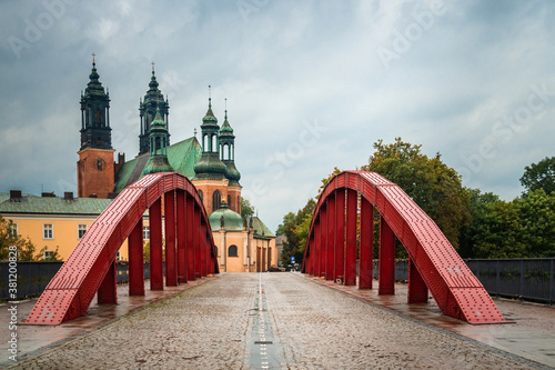The Red Bridge to Tumskiy Island, view in rainy weather: Poznan / Poland - September 27, 2020