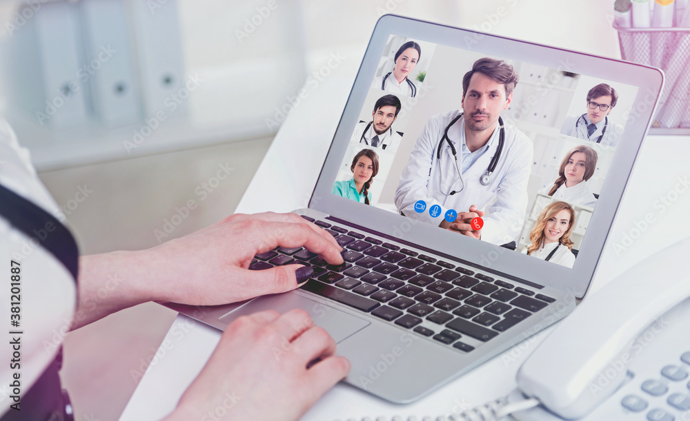 Young woman video chatting with medical doctors Young woman video chatting with medical doctors