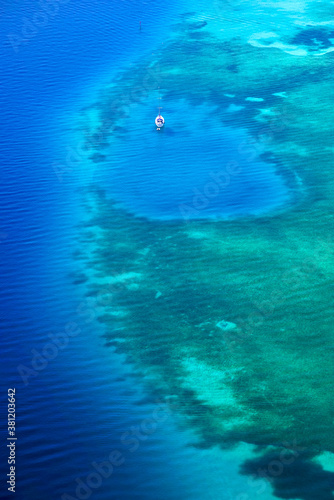 White yacht coral reef in beautiful bay sea. Aerial view.