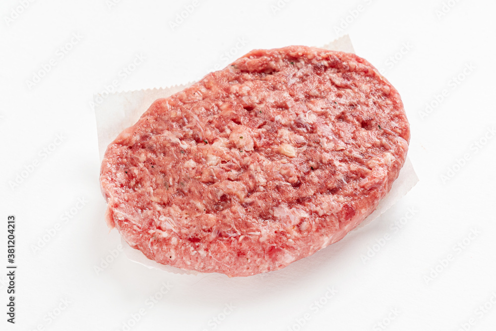 Raw minced homemade cutlets, on the white background Raw minced homemade cutlets, on the white background