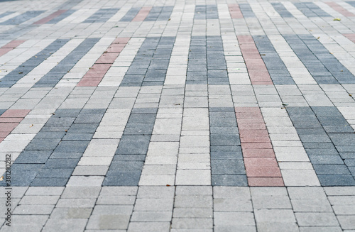 New pavement made from red and white pavement blocks. Selective focus.