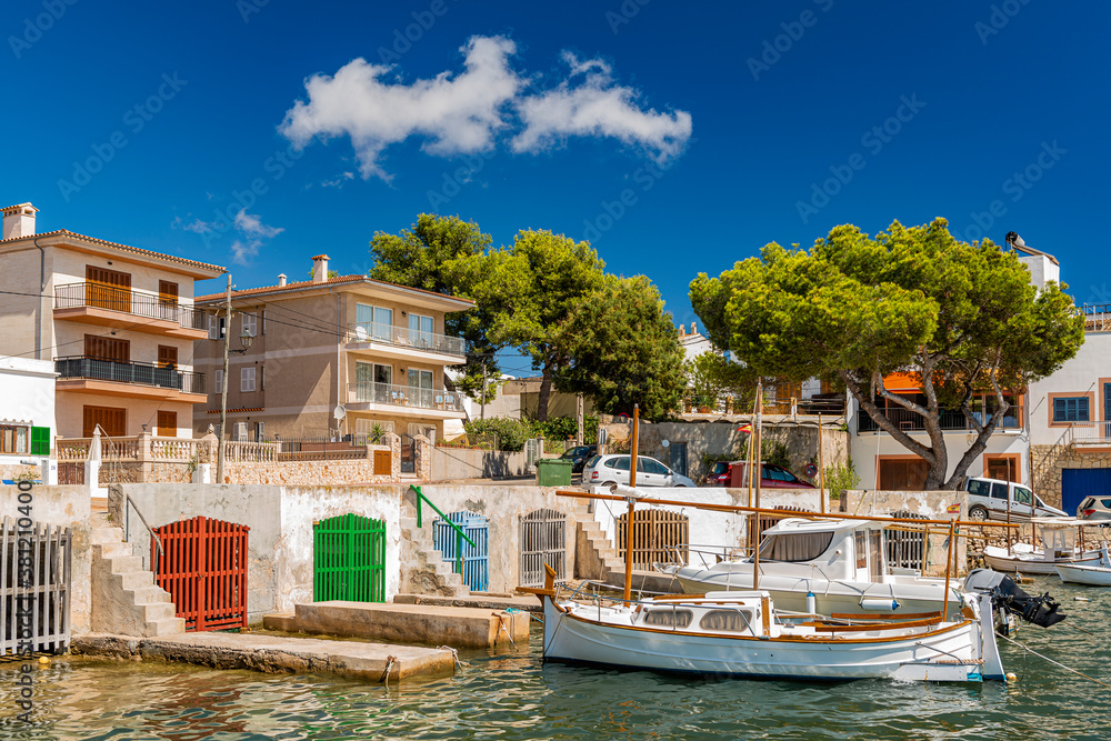 Boats in front of the old boathouses in Portocolom - 3687