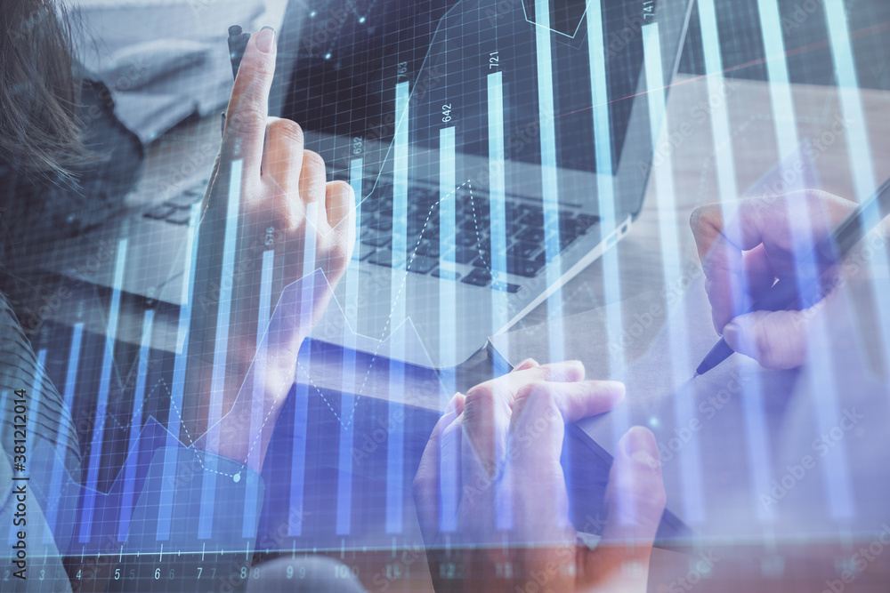 Double exposure of man and woman working together and forex chart hologram. Business concept. Computer background. Double exposure of man and woman working together and forex chart hologram. Business concept. Computer background.