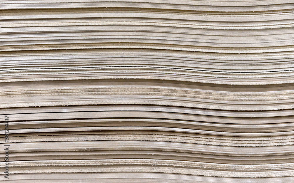 Fiberboard sheets in a stack. Hardboard for thermal insulation and