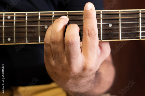 close up of a guitar player