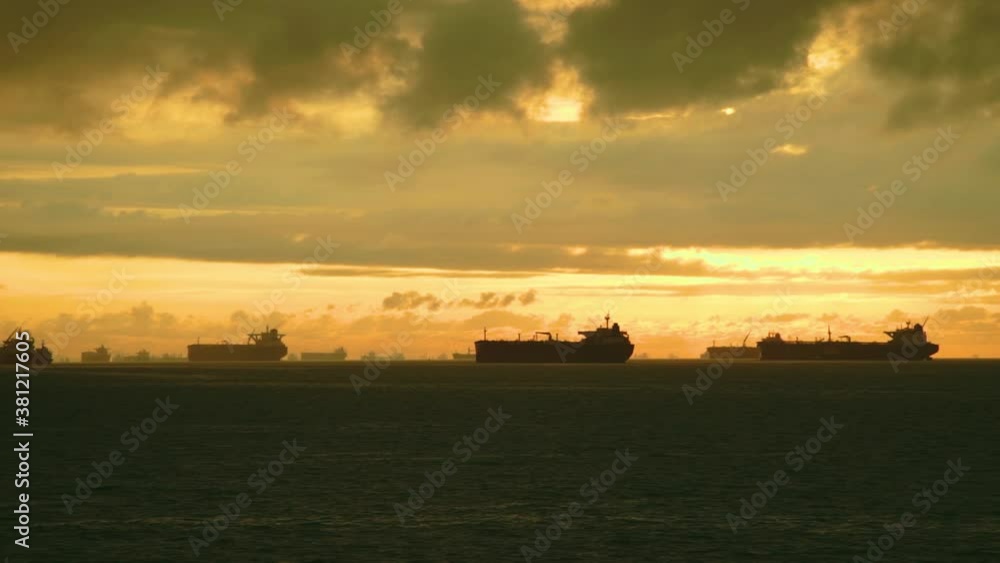 Many ships are anchored in the port of Singapore. Many ships are anchored in the port of Singapore.