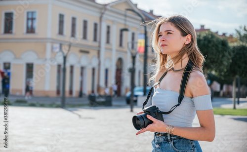 Tourist woman using her professional camera