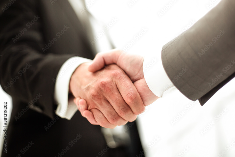 close up. reliable business partners shaking hands
