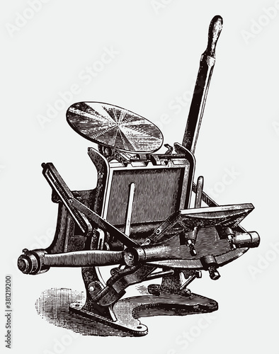 Antique hand-operated platen printing press in three quarter view