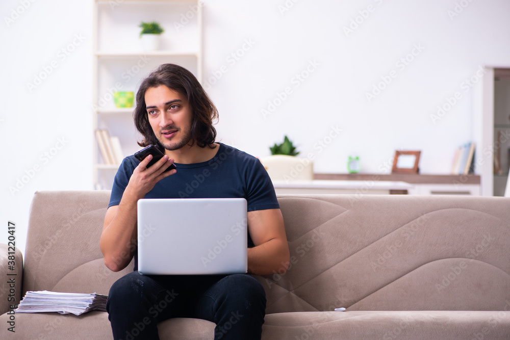 Young man employee working from house Young man employee working from house