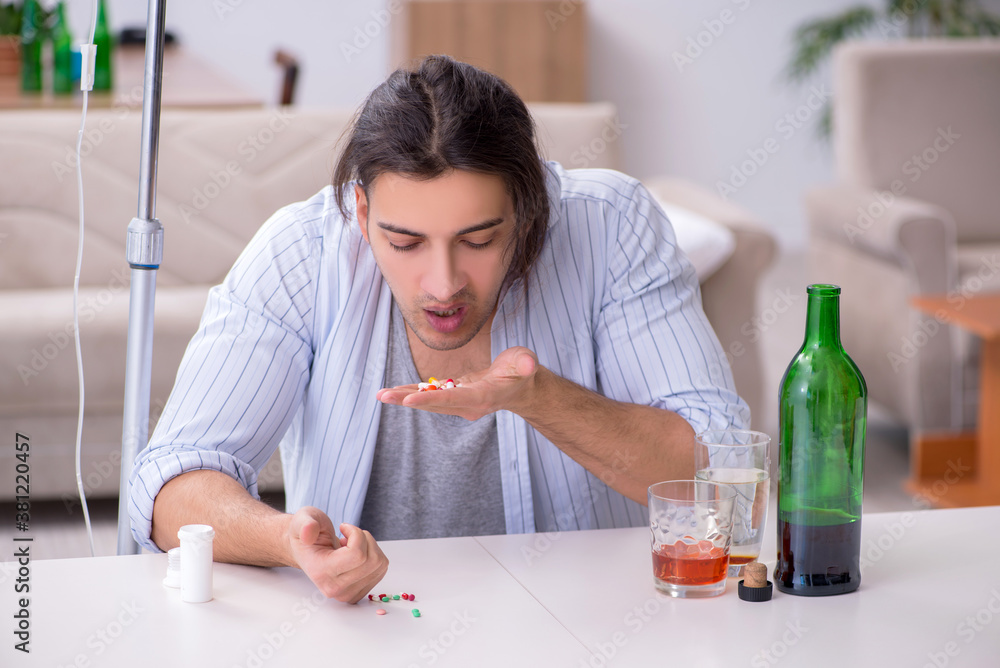Young man in alcohol addiction treatment concept Young man in alcohol addiction treatment concept
