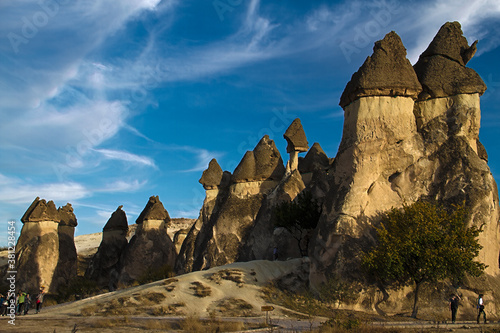 Mushroom stone valley Rock Formations in Cappadocia in Turkey with Golden light and dark blue sky