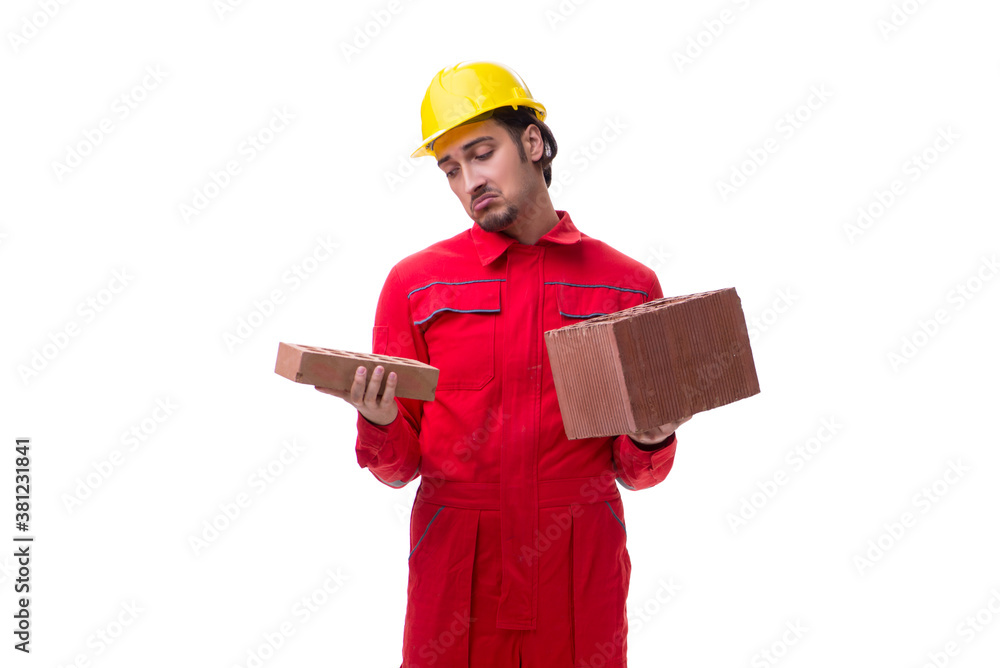 Young male mason with brick isolated on white