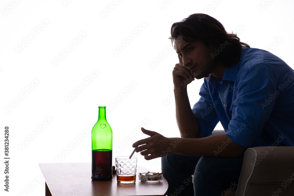 Young man suffering from alcoholism Young man suffering from alcoholism