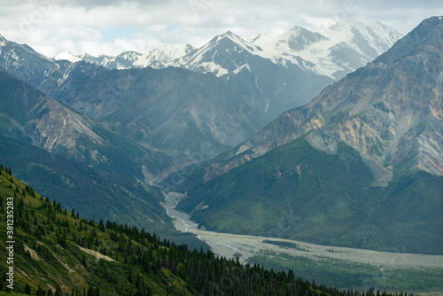 View on the Sheep Creek Trail of a river running through the valley in Kluane National Park, Yukon, Canada