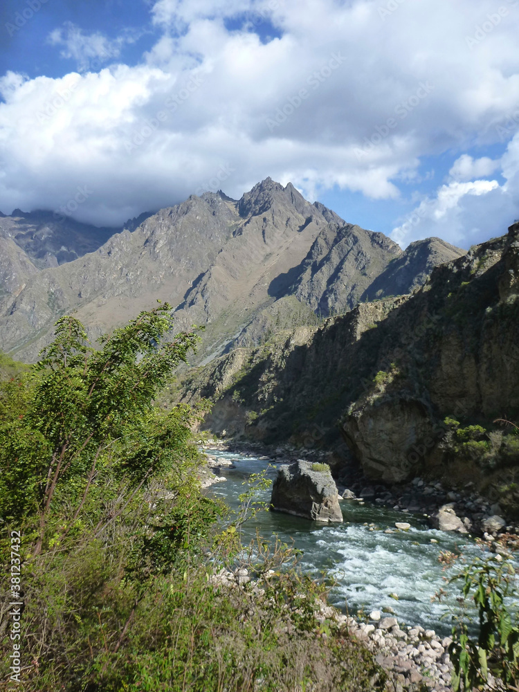 The flowing Urumbamba River of Peru, as seen from a train between Machu Picchu and Cusco