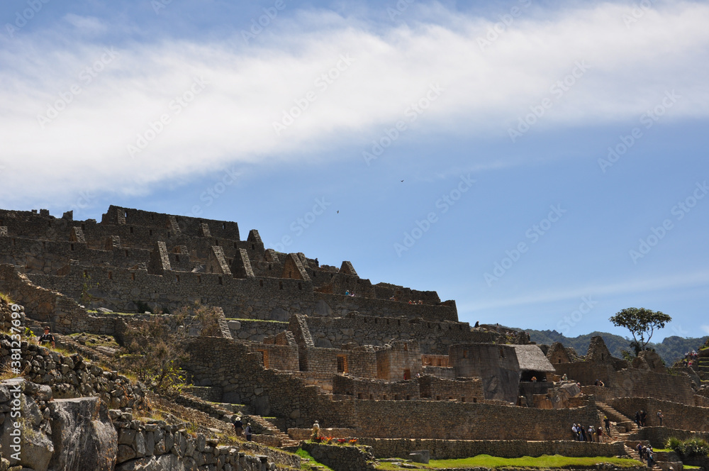 A close up view of the stone buildings and ruins inside the ancient Incan city of Machu Picchu
