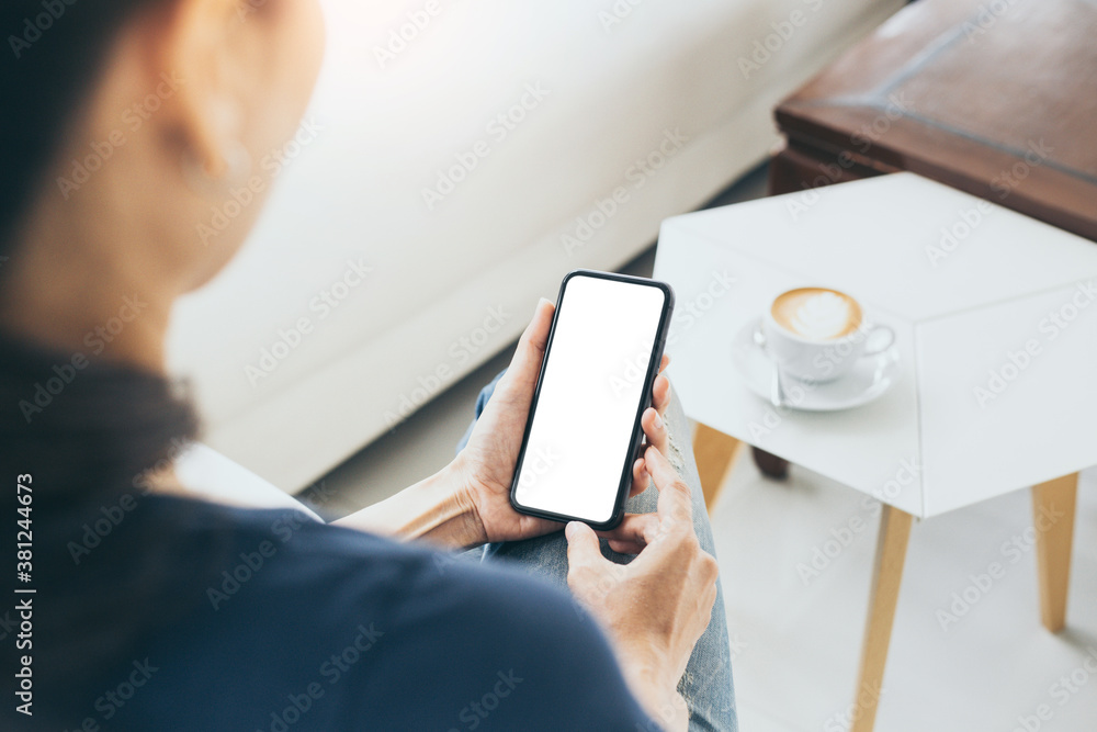 cell phone mockup blank white screen.woman hand holding texting using mobile on desk at coffee shop.background empty space for advertise.work people contact marketing business,technology cell phone mockup blank white screen.woman hand holding texting using mobile on desk at coffee shop.background empty space for advertise.work people contact marketing business,technology