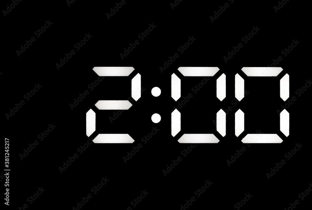 Real white led digital clock on black background Real white led digital clock on black background