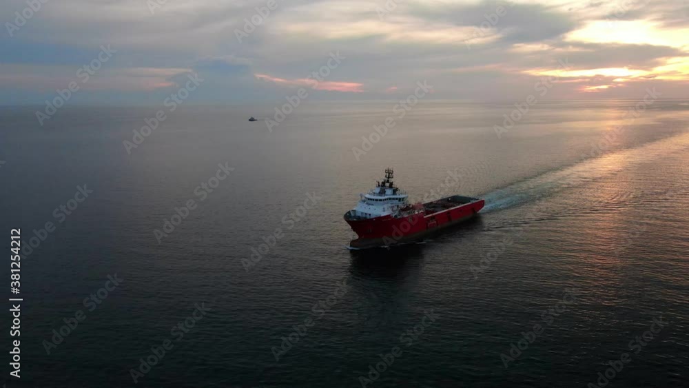 A large tug for transporting ships by water is in the Indian ocean. A large tug for transporting ships by water is in the Indian ocean.
