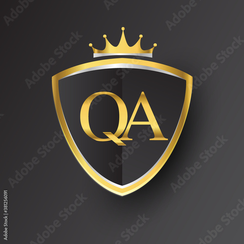 Initial logo letter QA with shield and crown Icon golden color isolated on black background, logotype design for company identity.