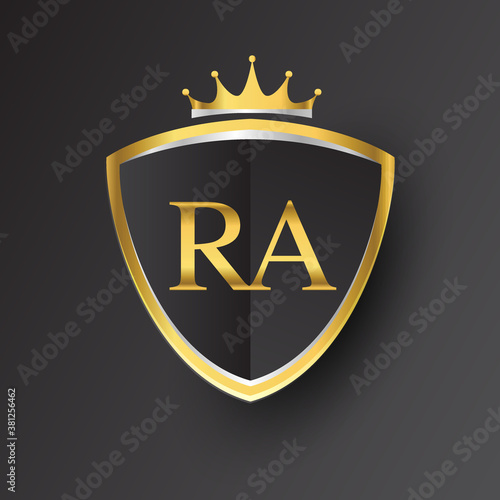 Initial logo letter RA with shield and crown Icon golden color isolated on black background, logotype design for company identity.