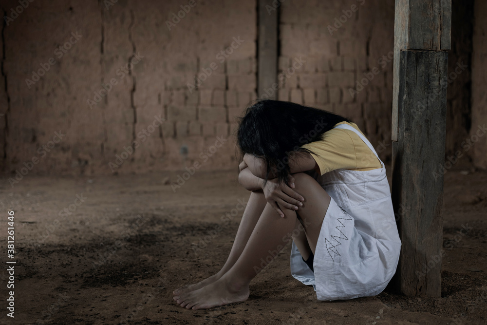 Human trafficking concept.Young girl sitting in old room.teenager girl victims of trafficking.