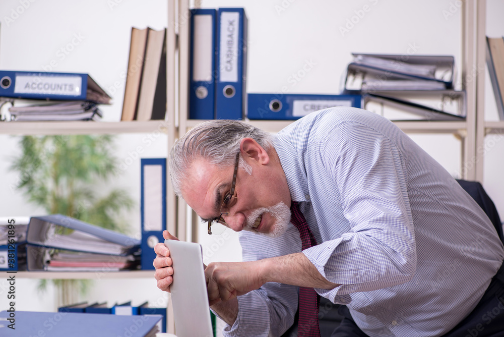 Old male employee unhappy with excessive work Old male employee unhappy with excessive work
