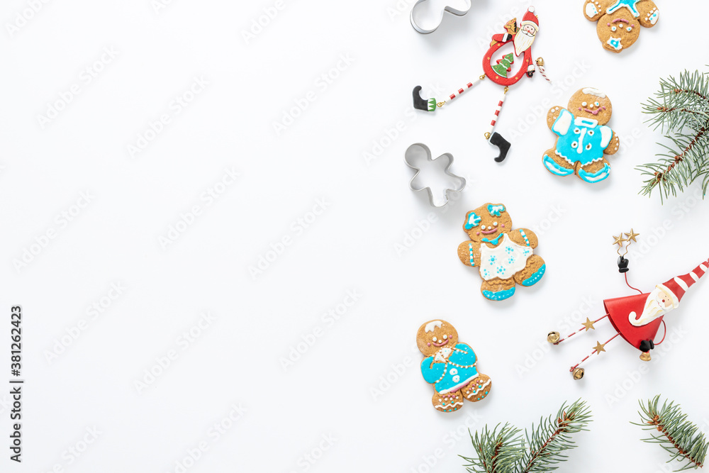 Obraz premium Christmas holiday cookies on white background with decorations top view copy space