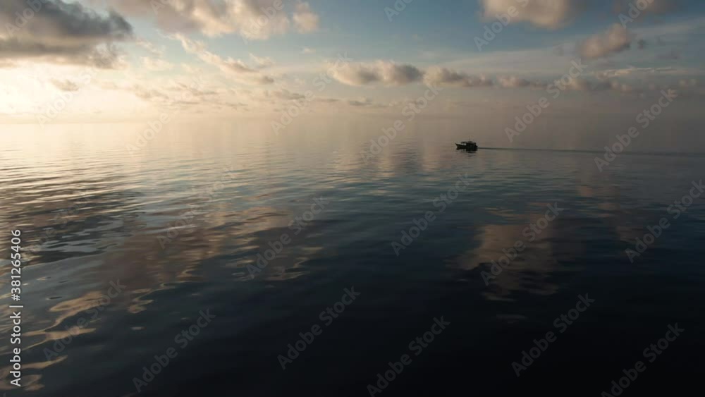 A fishing vessel catches fish in the open ocean. Aerial 4K shot. A fishing vessel catches fish in the open ocean. Aerial 4K shot.