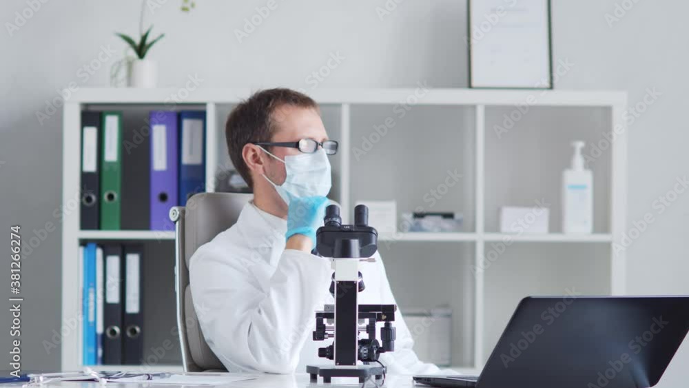 Professional medical doctor working in laboratory using microscope. Professional medical doctor working in laboratory using microscope.