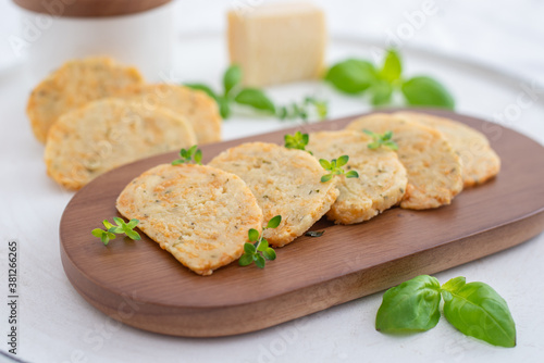 home made cheese crackers with herbs on a table