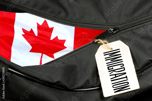 Foto A bag, flag of Canada and immigration