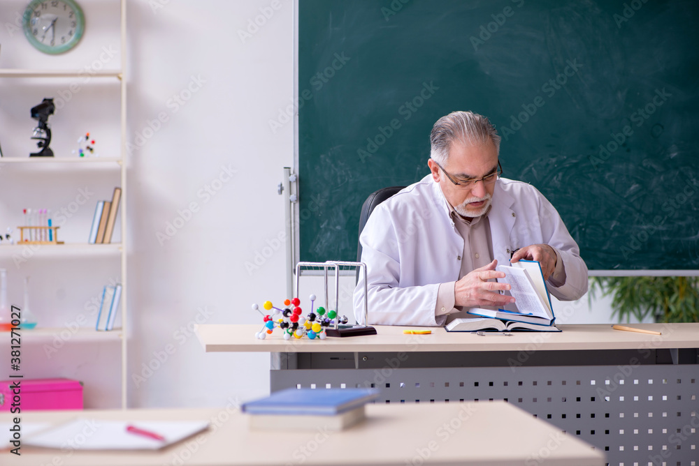 Experienced old scientist working in the lab Experienced old scientist working in the lab
