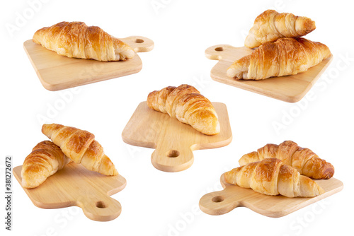 croissant recipe on wooden plate isolated over white background