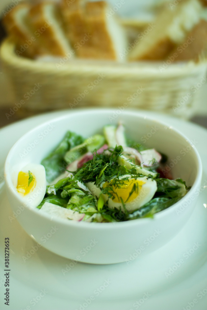 Fresh mixed salad with eggs, lettuce and other vegetables.