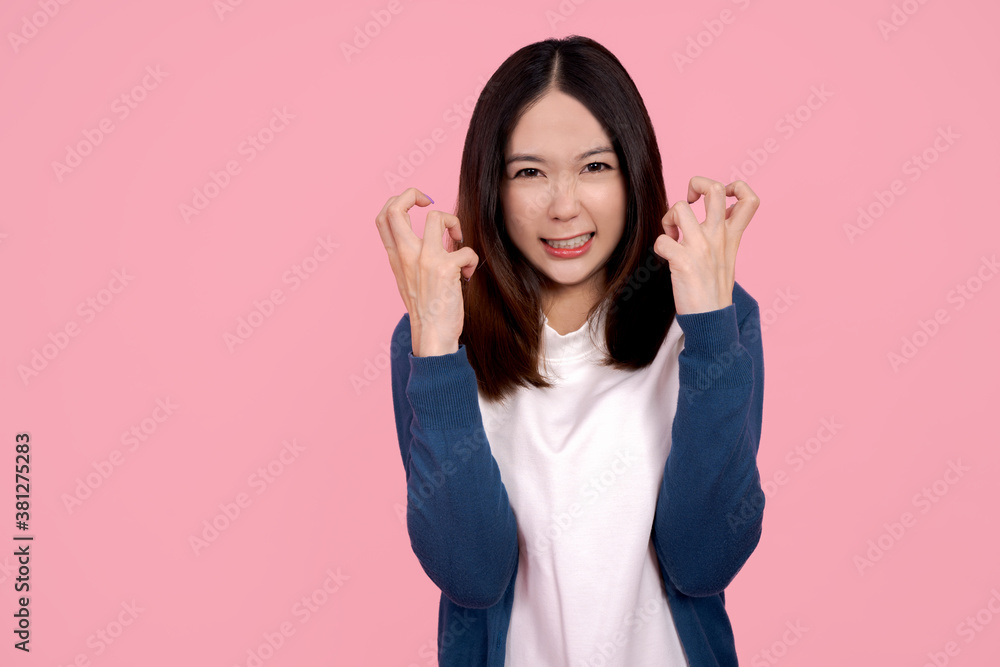 Asian woman are very angry on pink background. Asian woman are very angry on pink background.
