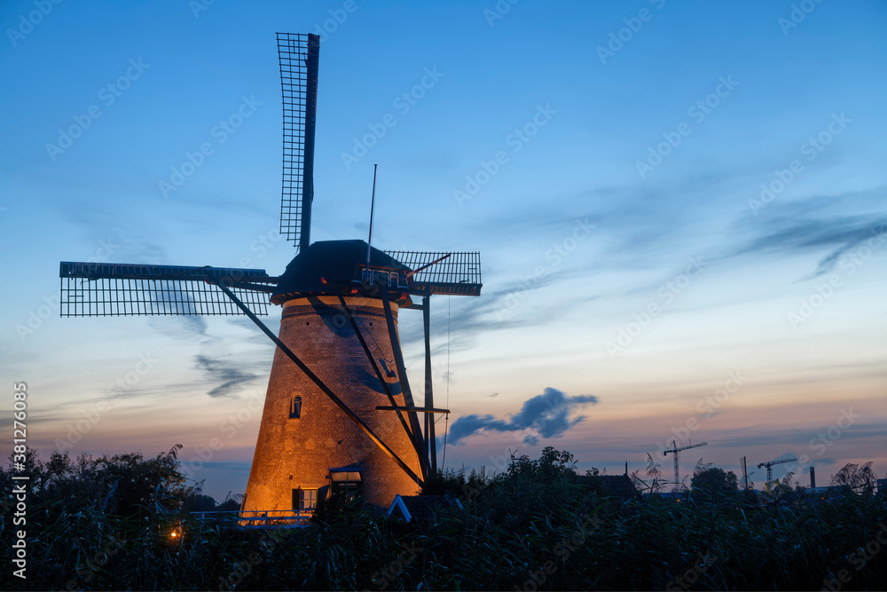 Illuminated windmill at Kinderdijk, The Netherlands.