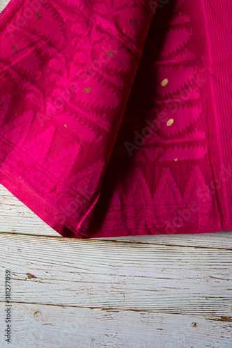 Red cotton sari with traditional patterns on a background. photo